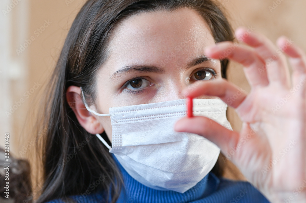 Coronavirus treatment concept. Fighting the virus. The girl feels bad. close-up. The first signs of coronavirus. The concept of a viral or allergic disease Coronavirus treatment concept. Fighting the virus. The girl feels bad. close-up. The first signs of coronavirus. The concept of a viral or allergic disease