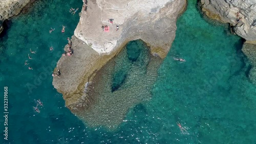 Grotto of Pula town, clean blue water of Adriatic sea with rocky beach, Istria region