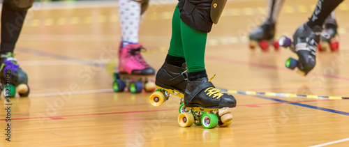 Roller skates of a person participating in roller derby. © Trygve