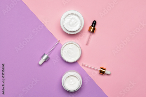 Three white cosmetic cream ...