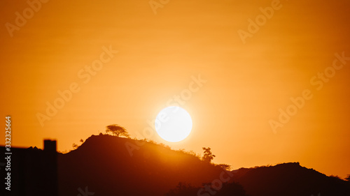 Sun besides the mountain during sunset at Mount Abu in Rajasthan  India