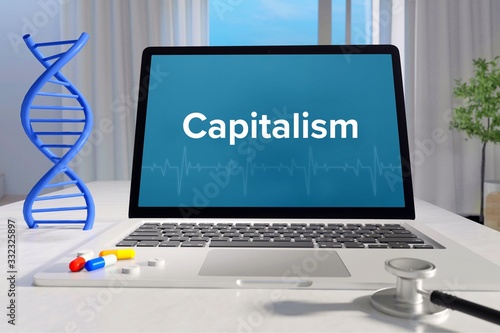 Capitalism – Medicine/health. Computer in the office with term on the screen. Science/healthcare