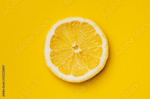 Slice of yellow lemon.