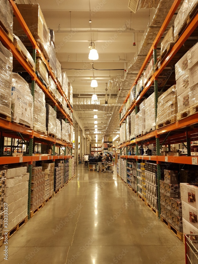 Long corridor of warehouse, with light bulbs at the ceiling
