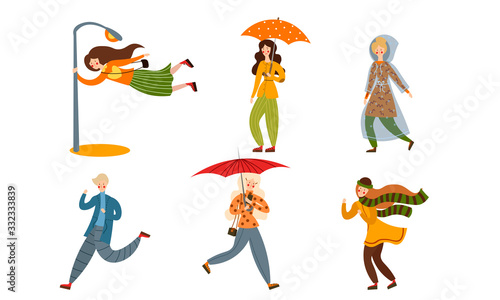 Set of various people on a rainy and windy day. Vector illustration in flat cartoon style.
