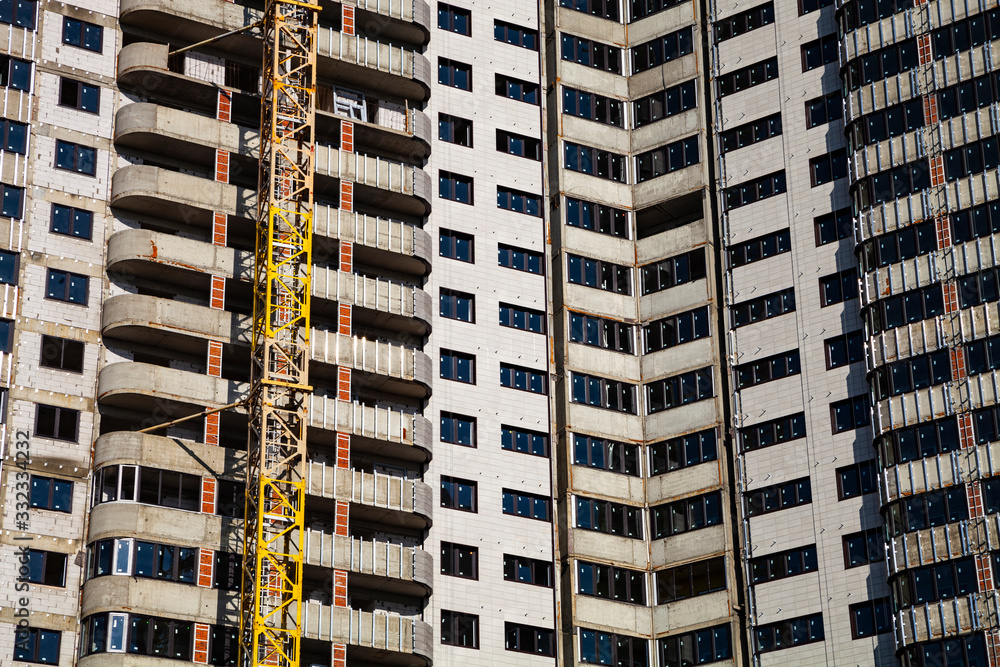 Fototapeta premium Unfinished high-rise apartment building.