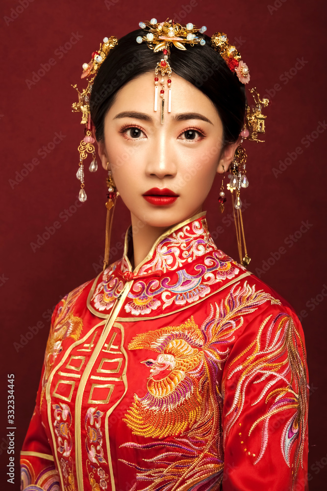 Asian brides in red wedding vintage dress on red background