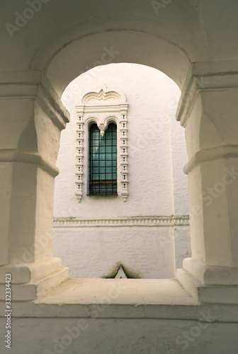 Window and arch made of white stone photo