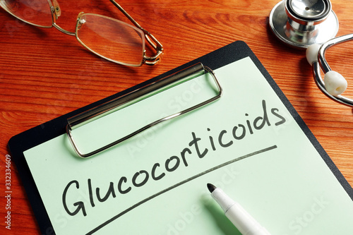 Glucocorticoids sign as part of corticosteroids or steroid hormones and stethoscope. photo