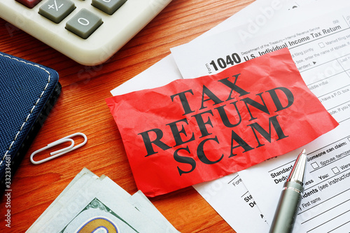 Tax refund scam red sheet about fraud and money. photo