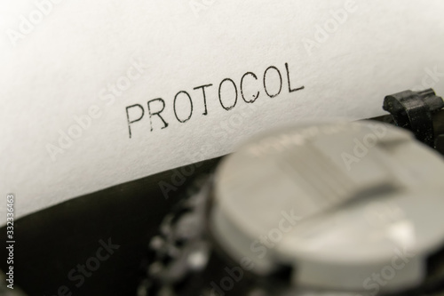 Close up printed text Protocol on an old typewriter