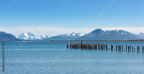 Old jetty with king cormorants at Ultima Esperanza Fjord near Puerto Natales, Patagonia, Chile photo