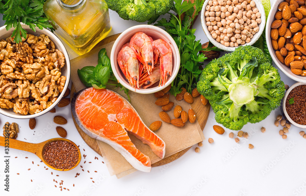 Food sources of omega 3 and omega 6 on white background top view. Foods