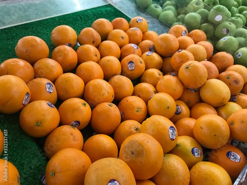 Fresh orange fruit sells at market