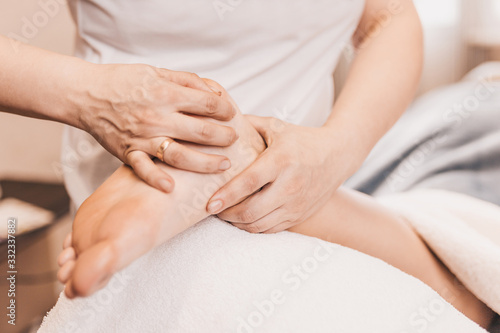 Foot massage - pressure technique for painful areas