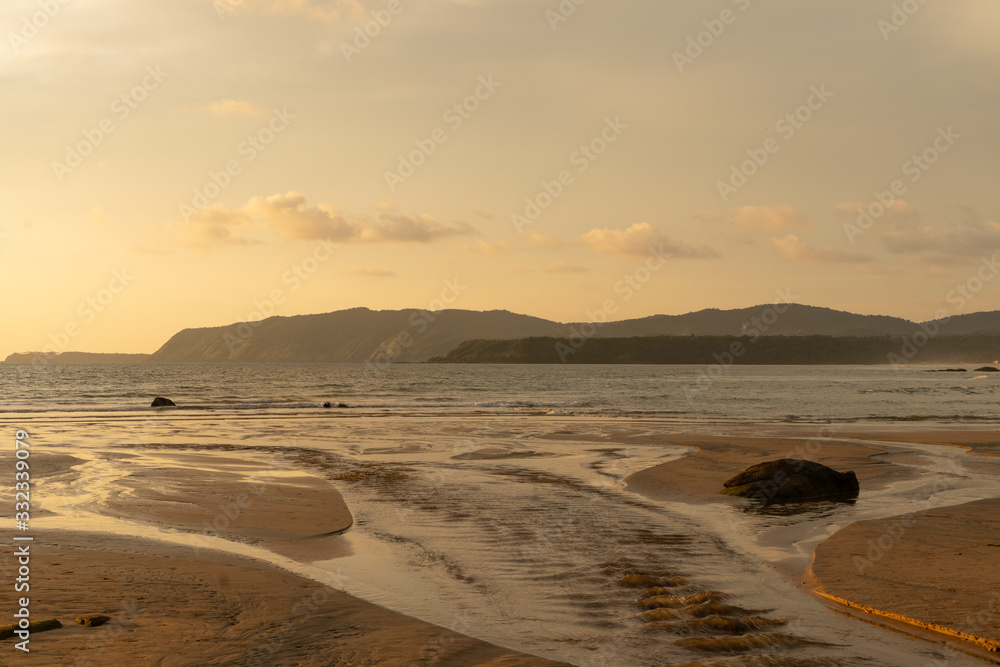 beautiful colorful sunset on agonda beach in goa, india beautiful colorful sunset on agonda beach in goa, india