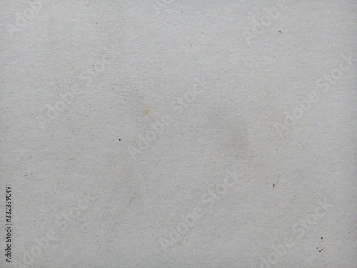 Stain on old white paper sheet texture background. Stained paper. Aged paper background. White aged.