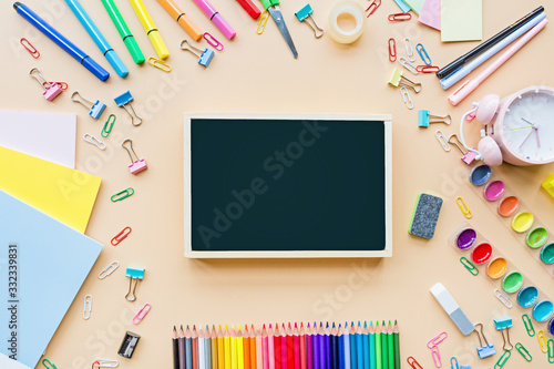 Back to School background with place for text. Collection of school supplies in a bright flat style. Educational concept. Copy space, mockup, overhead, template.