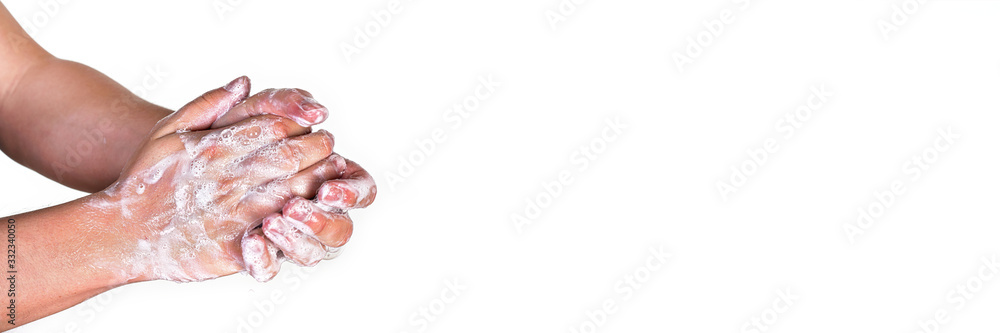 Young man washing hands with soap, wide banner space for text right side, isolated on white. Can be used during coronavirus covid19 outbreak prevention Young man washing hands with soap, wide banner space for text right side, isolated on white. Can be used during coronavirus covid19 outbreak prevention