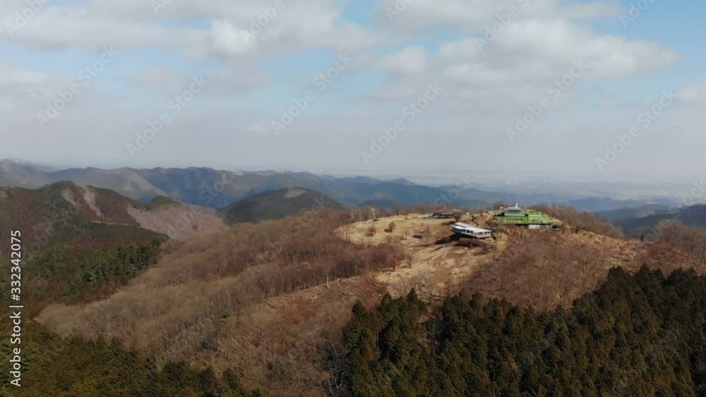Carved Mountain Peak With Dried Forest Trees - aerial shot Carved Mountain Peak With Dried Forest Trees - aerial shot