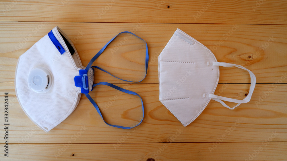 Mask for protection PM 2.5 dust on wooden table Mask for protection PM 2.5 dust on wooden table