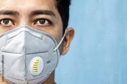 A man is wearing n95 mask for protect covid 19 and air pollution pm2.5 photo