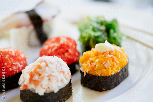 Sushi serving on a plate in restaurant