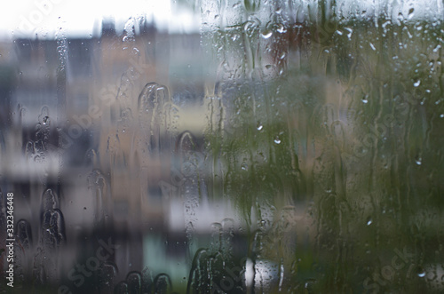 Wallpaper Mural Rain drops on window glasses surface with bokeh background. Torontodigital.ca