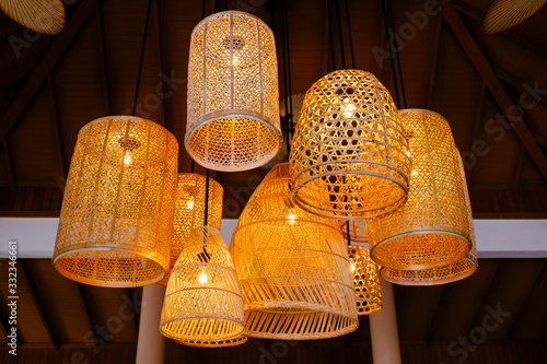 Wooden lanterns handing from the ceiling in Thailand