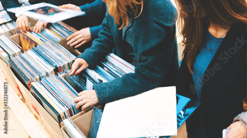 Women Selecting Vinyl Records in a Record Store