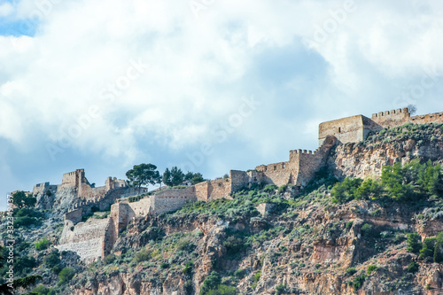  old fortress on mountain  background with historical building