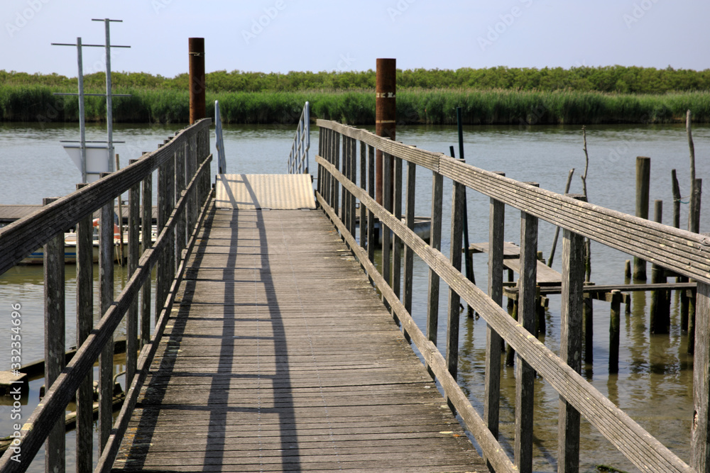 Fototapeta premium Po river (FE), Italy - April 30, 2017: A marina near Po river, Delta Regional Park, Emilia Romagna, Italy