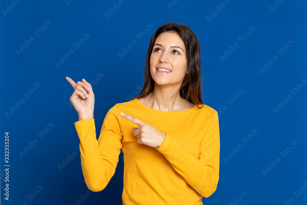 Brunette girl wearing a yellow T-shirt Brunette girl wearing a yellow T-shirt