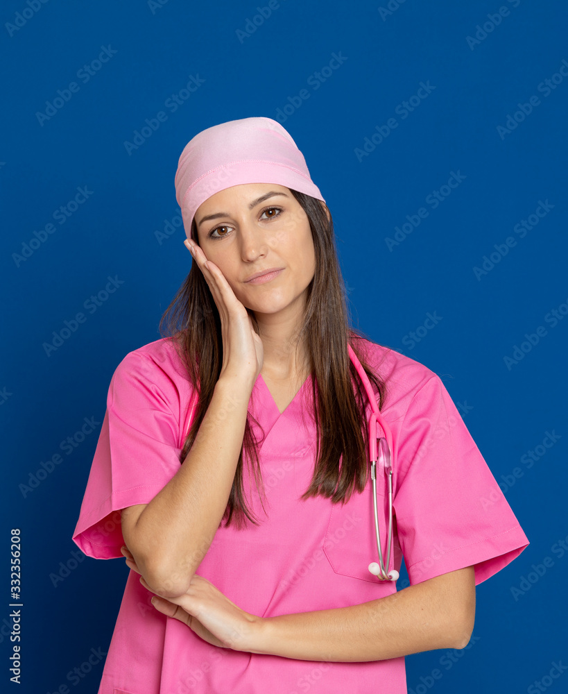 Young doctor with a pink uniform Young doctor with a pink uniform