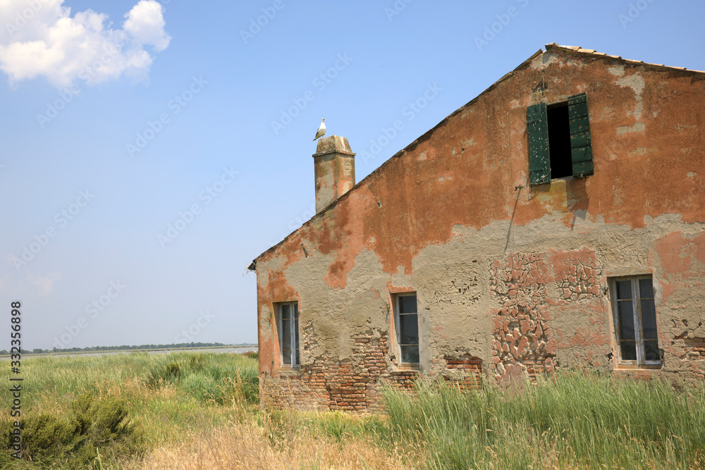 Po river (FE),  Italy - April 30, 2017: An old Fisherman's house detail on Po river, Delta Regional Park, Emilia Romagna, Italy