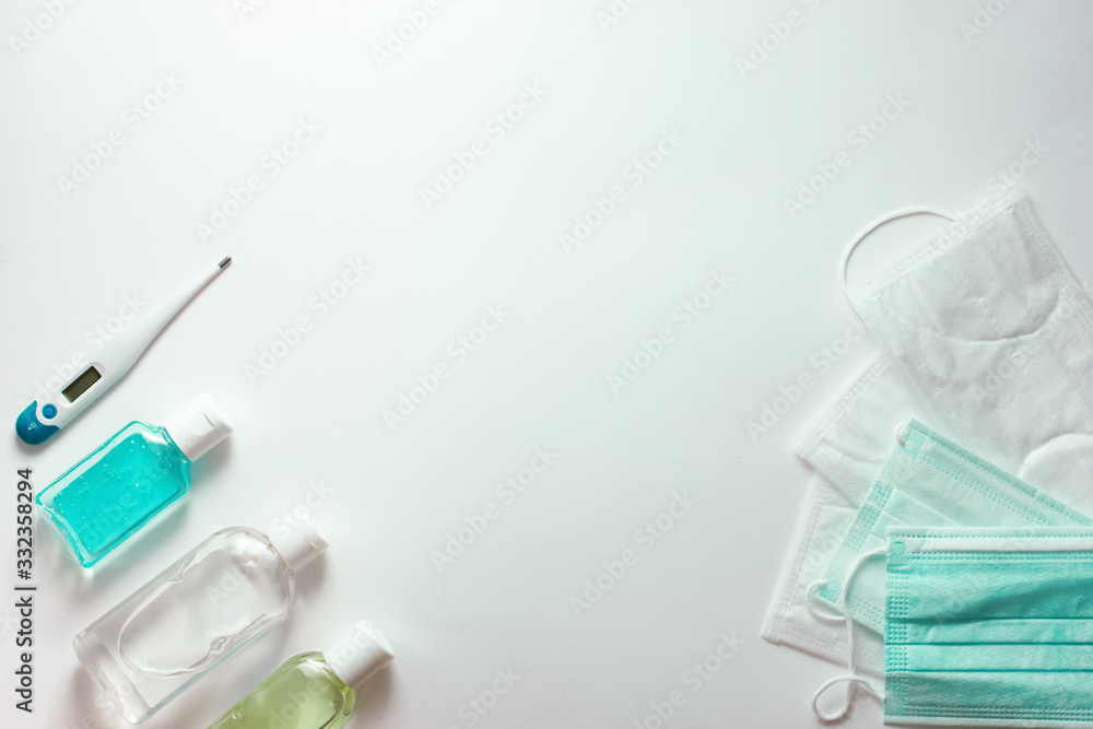 Coronavirus prevention. medical masks, thermometer and sanitizer gel for hand hygiene. corona virus epidemy protection. hygiene importance Coronavirus prevention. medical masks, thermometer and sanitizer gel for hand hygiene. corona virus epidemy protection. hygiene importance