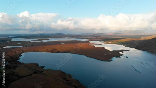 Embayed coast of lake with blue water from drone photo