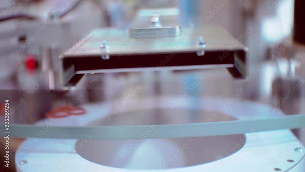 modern production and technology.production line fragment.small parts moving quickly on a transparent circular conveyor.close-up.shallow depth of field modern production and technology.production line fragment.small parts moving quickly on a transparent circular conveyor.close-up.shallow depth of field