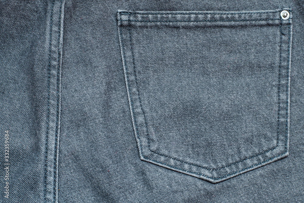 Fragment of gray jeans with a back pocket Fragment of gray jeans with a back pocket