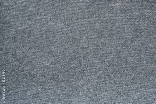 Fragment of denim gray. Gray background