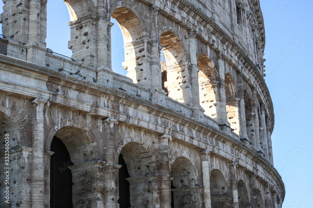 The Colosseum in Rome, Italy. Picturesque views of the ruins in summer.