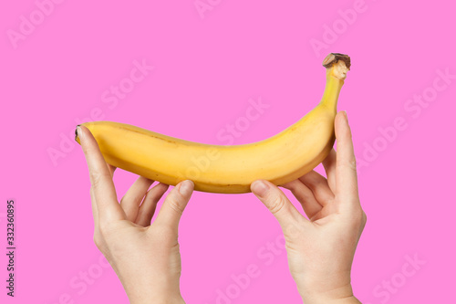 Measuring the size of a banana as a symbol of the male penis. Big dick length. Strong erection and impotence problem.