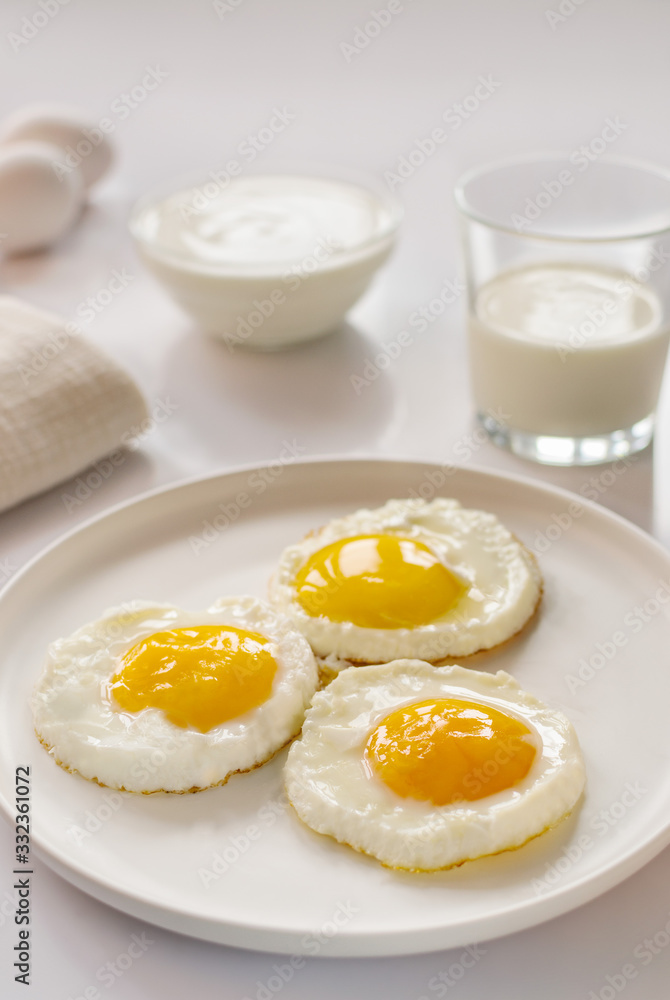 breakfast with fried eggs, yogurt and milk breakfast with fried eggs, yogurt and milk