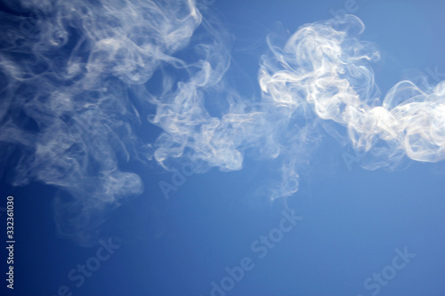 smoke towards the blue sky