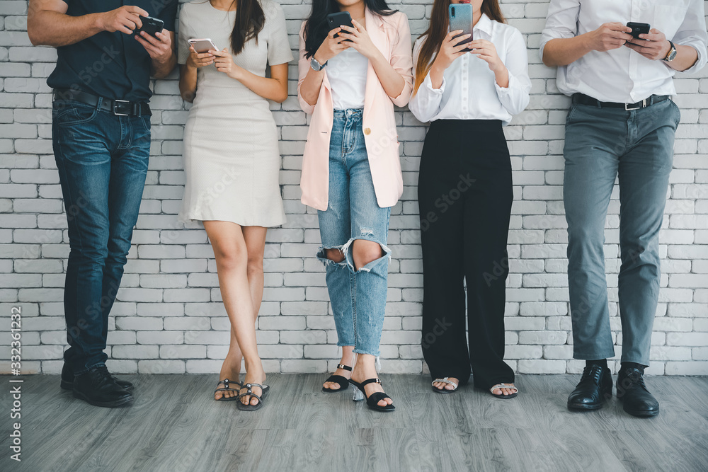 standing people with their smartphone