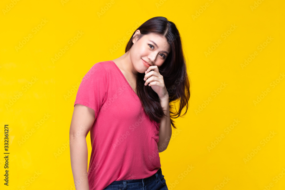 Image of feeling smile and happy. Cheerful young asian woman with brunette long hair in casual shirt smiling with teeth on yellow background. Female face expressions and emotions concept. Image of feeling smile and happy. Cheerful young asian woman with brunette long hair in casual shirt smiling with teeth on yellow background. Female face expressions and emotions concept.