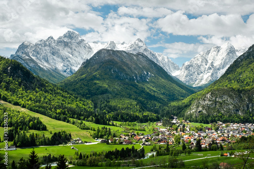 Photos Mojstrana village in the Triglav National Park during spring with mountains in t