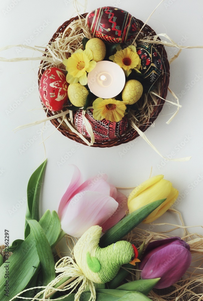 Beautiful Eastern style flat lay with traditional painted eggs and tulips