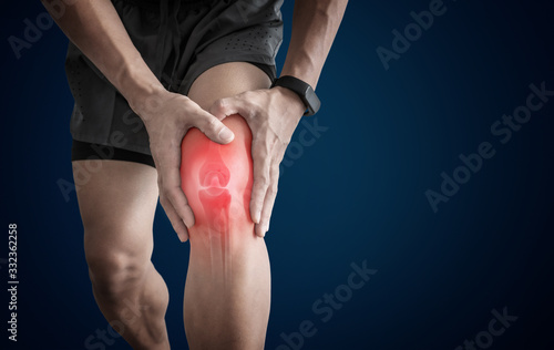 Joint pain, Arthritis and tendon problems. a man touching nee at pain point photo