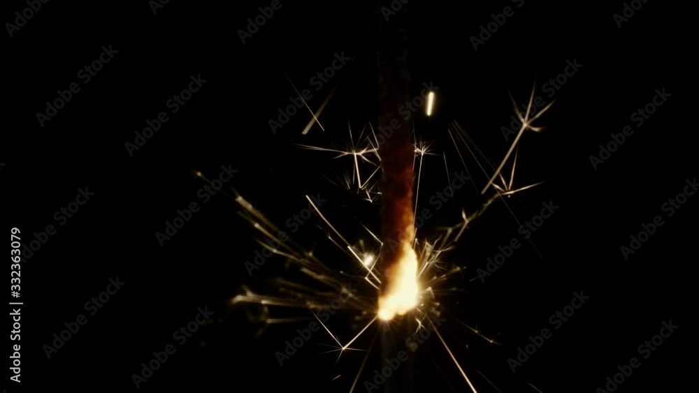 Bengal fire sparkle burning in the dark on black background, 4k super slow motion Bengal fire sparkle burning in the dark on black background, 4k super slow motion